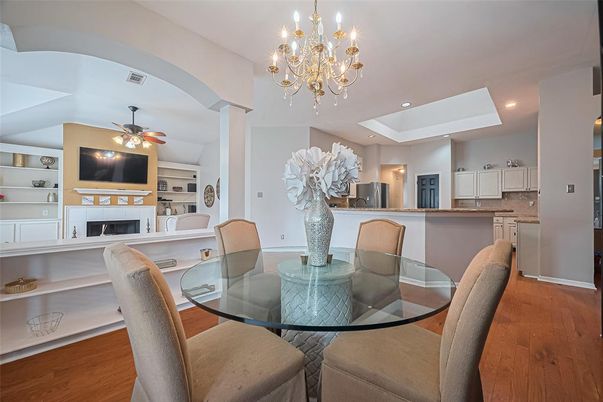 Chandelier, Dining room, Fireplace, Interior, Kitchen, Recessed Lighting, Wood Texture Flooring