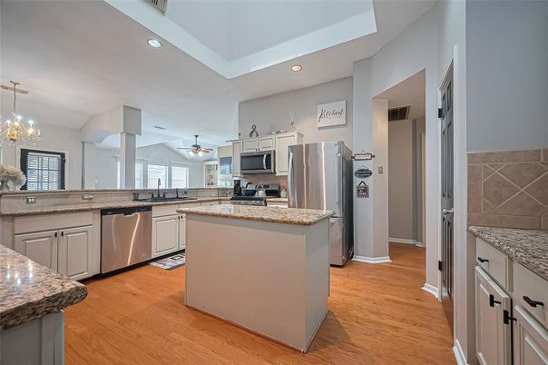 Chandelier, Interior, Kitchen, Pendant Lights, Recessed Lighting, Stainless Steel Appliances, Wood Texture Flooring