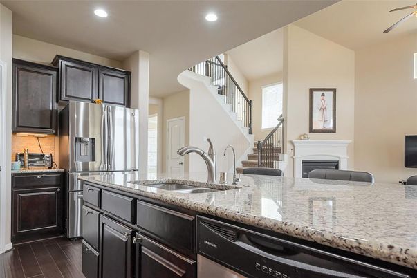 Fireplace, Interior, Kitchen, Recessed Lighting, Stainless Steel Appliances, Wood Texture Flooring