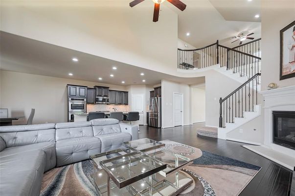 Dining room, Fireplace, Interior, Kitchen, Living room, Recessed Lighting, Stainless Steel Appliances, Wood Texture Flooring
