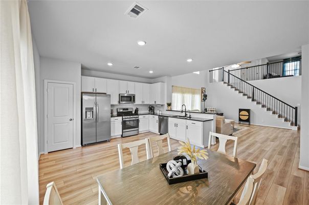 Dining room, Interior, Kitchen, Recessed Lighting, Stainless Steel Appliances, Wood Texture Flooring