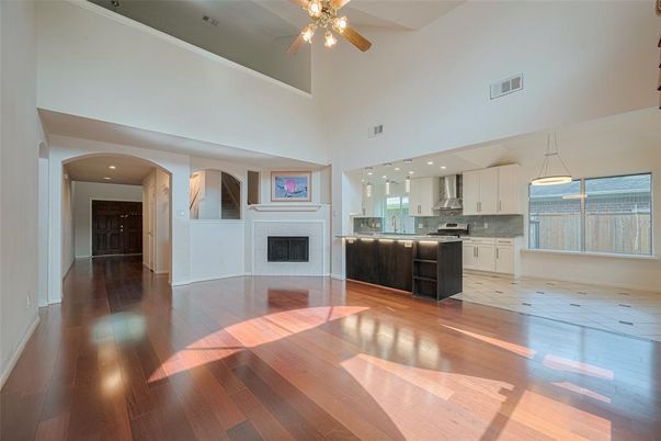 Fireplace, Interior, Kitchen, Pendant Lights, Recessed Lighting, Stainless Steel Appliances, Wood Texture Flooring