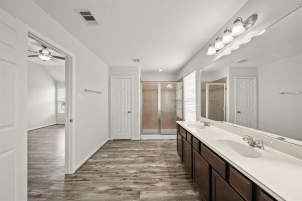 Bathroom, Dual Sink Vanities, Glass Shower, Interior, Recessed Lighting, Wood Texture Flooring