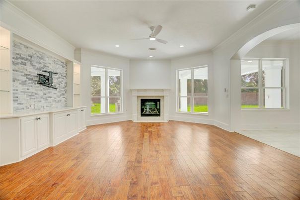 Empty room, Fireplace, Interior, Recessed Lighting, Stone Walls, Wood Texture Flooring