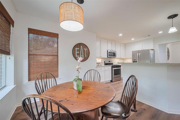 Dining room, Interior, Kitchen, Pendant Lights, Recessed Lighting, Stainless Steel Appliances, Wood Texture Flooring