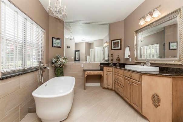 Bathroom, Chandelier, Dual Sink Vanities, Free Standing Baths, Interior, Pendant Lights, Wood Texture Flooring