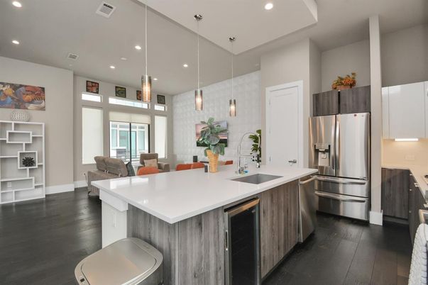 Dining room, Interior, Kitchen, Pendant Lights, Recessed Lighting, Stainless Steel Appliances, Wood Texture Flooring