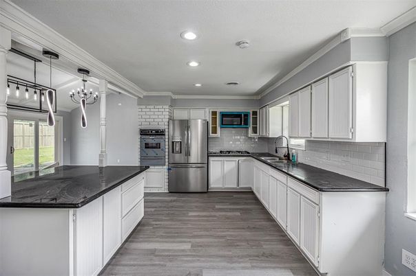 Chandelier, Interior, Kitchen, Pendant Lights, Recessed Lighting, Stainless Steel Appliances, Wood Texture Flooring