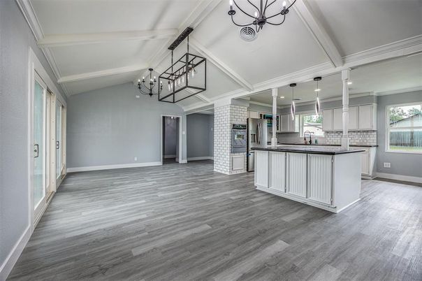 Chandelier, Empty room, Fireplace, Interior, Kitchen, Pendant Lights, Recessed Lighting, Wood Texture Flooring