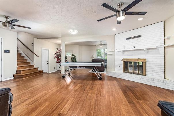 Billiard Table, Fireplace, Game Room, Interior, Piano, Recessed Lighting, Stone Walls, Wood Texture Flooring