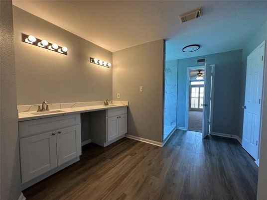 Bathroom, Dual Sink Vanities, Interior, Marble Walls, Wood Texture Flooring