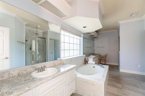 Bathroom, Dual Sink Vanities, Glass Shower, Interior, Recessed Lighting, Wood Texture Flooring