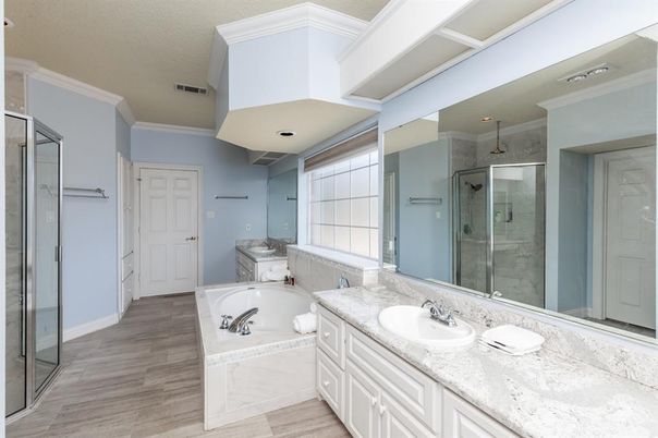 Bathroom, Dual Sink Vanities, Glass Shower, Interior, Recessed Lighting, Wood Texture Flooring