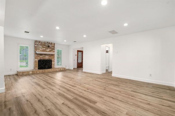 Empty room, Fireplace, Interior, Recessed Lighting, Stone Walls, Wood Texture Flooring