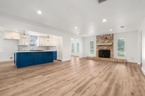 Empty room, Fireplace, Interior, Kitchen, Pendant Lights, Recessed Lighting, Stone Walls, Wood Texture Flooring