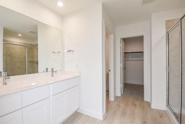 Bathroom, Dual Sink Vanities, Glass Shower, Interior, Recessed Lighting, Walk-in Closets, Wood Texture Flooring