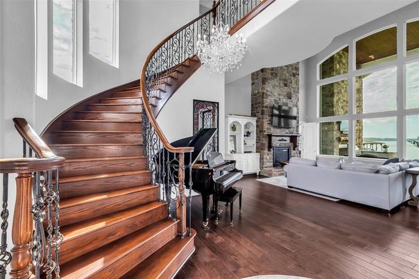 Chandelier, Fireplace, Interior, Living room, Piano, Stone Walls, Wood Texture Flooring