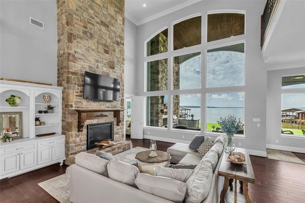Fireplace, Interior, Living room, Recessed Lighting, Stone Walls, Water, Wood Texture Flooring