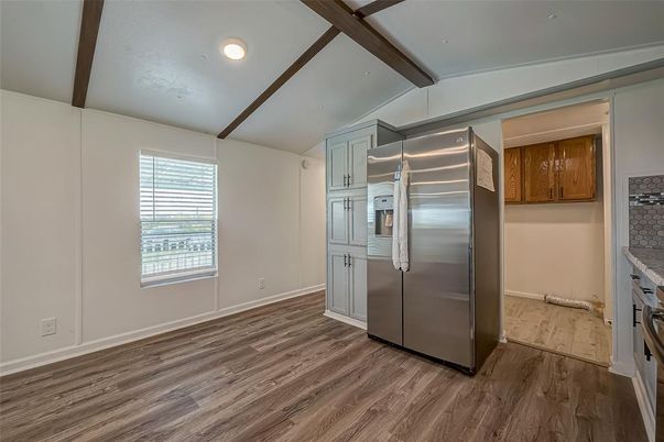 Empty room, Interior, Kitchen, Recessed Lighting, Stainless Steel Appliances, Wooden Beams, Wood Texture Flooring