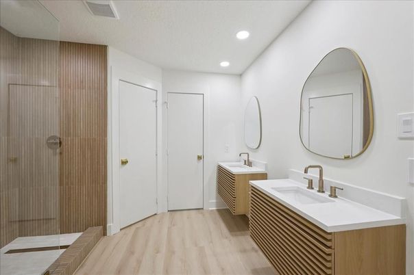 Bathroom, Dual Sink Vanities, Interior, Recessed Lighting, Wood Texture Flooring