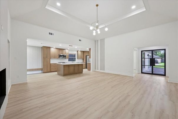 Empty room, Interior, Kitchen, Pendant Lights, Recessed Lighting, Stainless Steel Appliances, Wood Texture Flooring