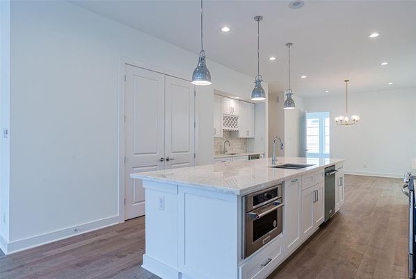 Chandelier, Interior, Kitchen, Pendant Lights, Recessed Lighting, Stainless Steel Appliances, Wood Texture Flooring