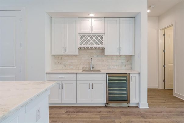 Interior, Kitchen, Marble Walls, Recessed Lighting, Stainless Steel Appliances, Wood Texture Flooring