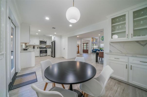 Dining room, Interior, Kitchen, Pendant Lights, Recessed Lighting, Stainless Steel Appliances, Wood Texture Flooring