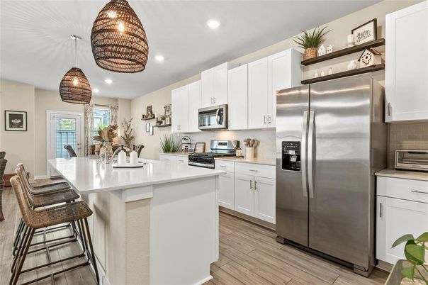 Dining room, Interior, Kitchen, Pendant Lights, Recessed Lighting, Stainless Steel Appliances, Wood Texture Flooring