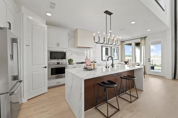 Interior, Kitchen, Marble Walls, Pendant Lights, Recessed Lighting, Stainless Steel Appliances, Wood Texture Flooring