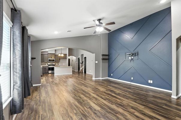 Empty room, Interior, Kitchen, Pendant Lights, Recessed Lighting, Stainless Steel Appliances, Wood Texture Flooring