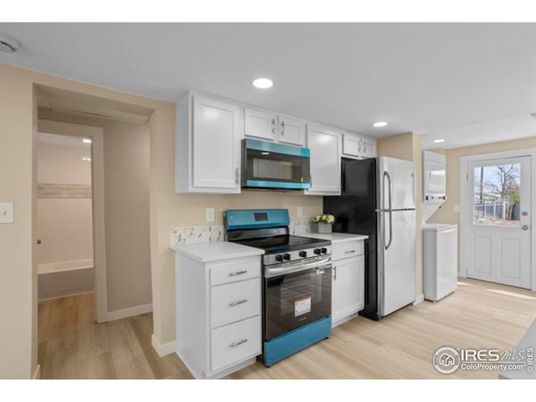 Interior, Kitchen, Recessed Lighting, Washer, Wood Texture Flooring