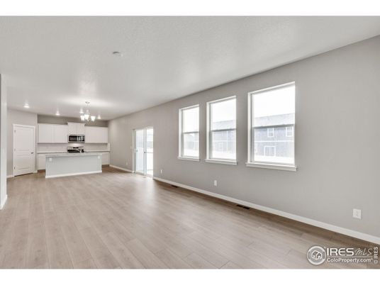 Chandelier, Empty room, Interior, Kitchen, Recessed Lighting, Stainless Steel Appliances, Wood Texture Flooring