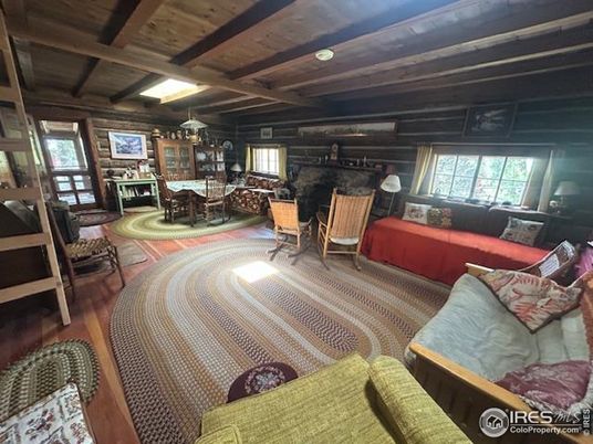 Chandelier, Dining room, Fireplace, Interior, Living room, Wooden Beams, Wooden Ceilings, Wood Texture Flooring, Wooden Walls