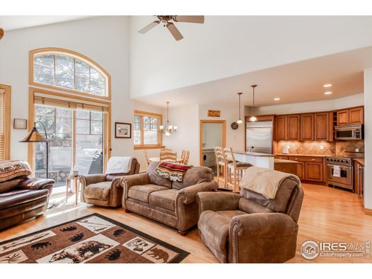 Chandelier, Dining room, Interior, Kitchen, Living room, Pendant Lights, Recessed Lighting, Stainless Steel Appliances, Wood Texture Flooring
