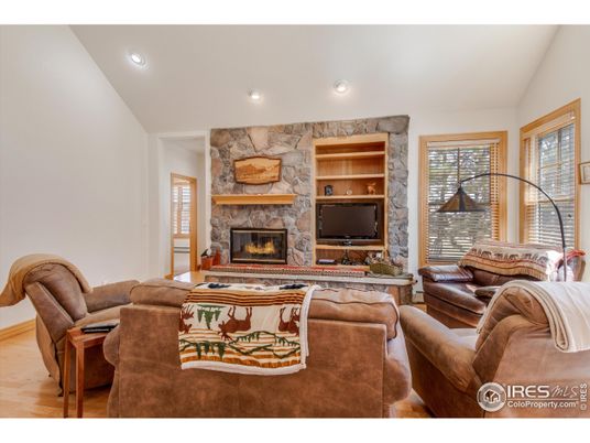 Fireplace, Interior, Living room, Recessed Lighting, Stone Walls, Wood Texture Flooring