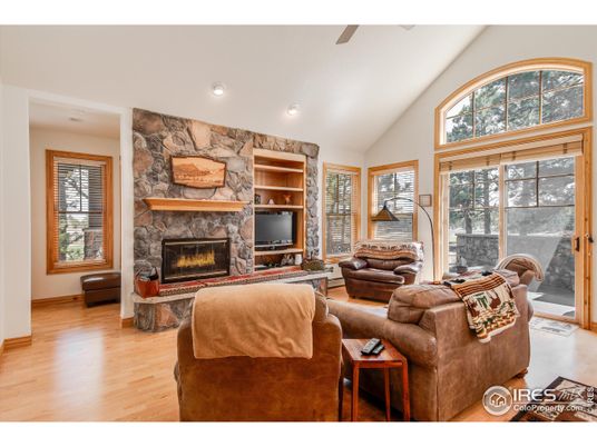Fireplace, Interior, Living room, Recessed Lighting, Stone Walls, Wood Texture Flooring