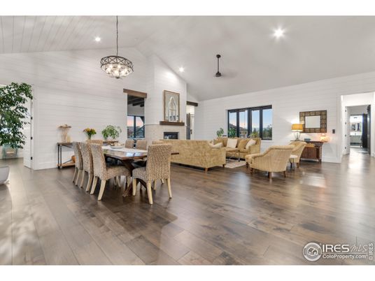 Chandelier, Dining room, Fireplace, Interior, Living room, Pendant Lights, Recessed Lighting, Wood Texture Flooring