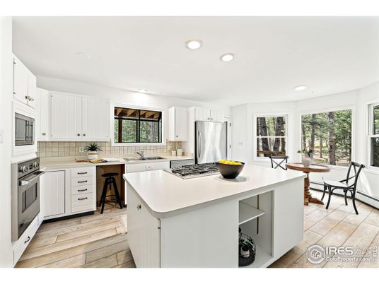 Dining room, Interior, Kitchen, Recessed Lighting, Stainless Steel Appliances, Wood Texture Flooring