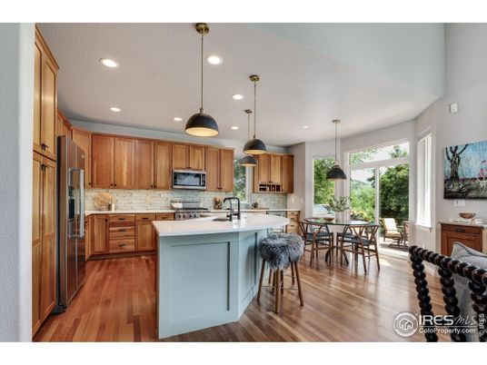 Dining room, Interior, Kitchen, Pendant Lights, Recessed Lighting, Stainless Steel Appliances, Wood Texture Flooring