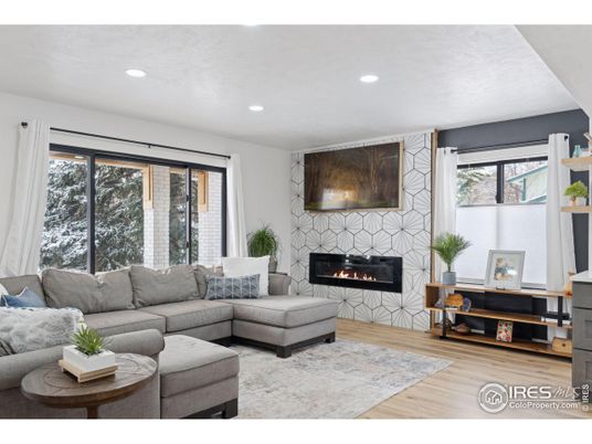 Fireplace, Interior, Living room, Recessed Lighting, Stone Walls, Wood Texture Flooring
