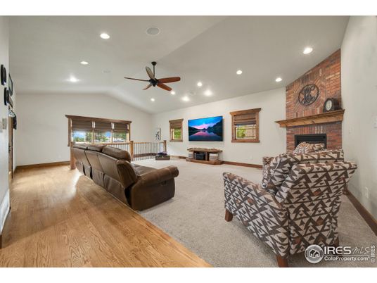 Fireplace, Interior, Living room, Recessed Lighting, Stone Walls, Wood Texture Flooring