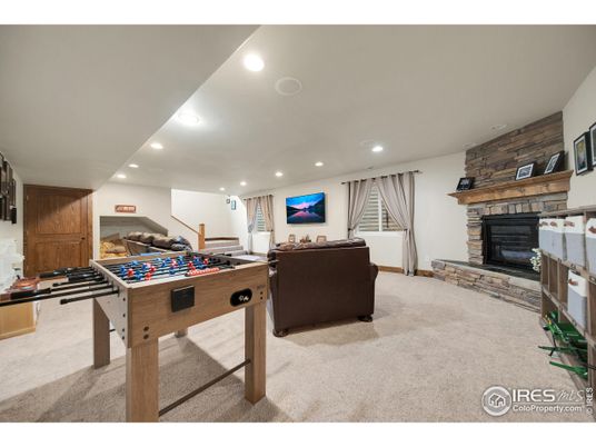 Fireplace, Game Room, Interior, Living room, Recessed Lighting, Stone Walls, Wooden Walls