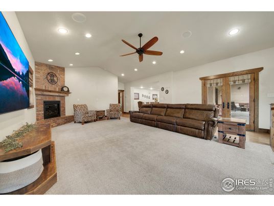 Fireplace, Interior, Living room, Recessed Lighting, Stone Walls, Wood Texture Flooring