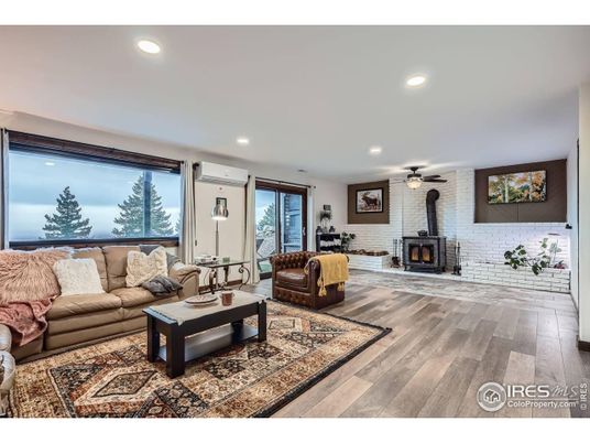 Fireplace, Interior, Living room, Recessed Lighting, Stone Walls, Wood Texture Flooring