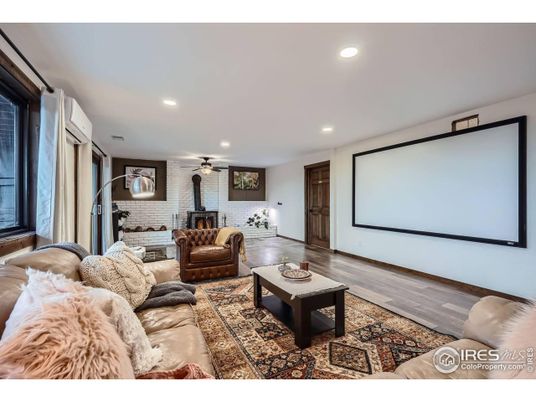 Interior, Living room, Projection Screen, Recessed Lighting, Stone Walls, Wood Texture Flooring