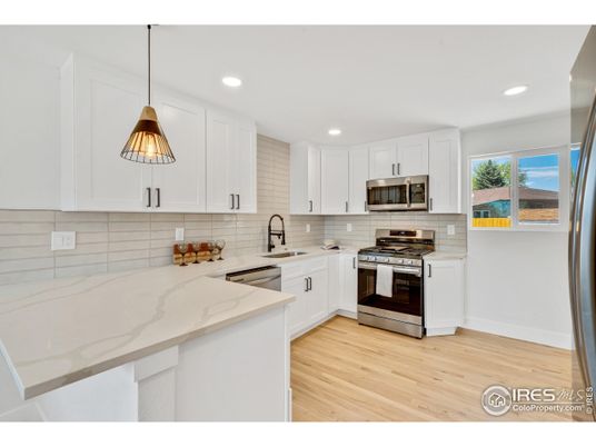 Interior, Kitchen, Pendant Lights, Recessed Lighting, Stainless Steel Appliances, Wood Texture Flooring