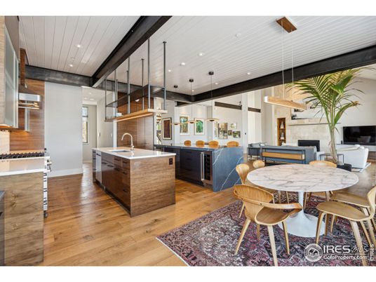 Dining room, Fireplace, Interior, Kitchen, Pendant Lights, Recessed Lighting, Stainless Steel Appliances, Wood Texture Flooring