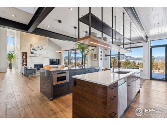 Fireplace, Interior, Kitchen, Living room, Pendant Lights, Recessed Lighting, Stainless Steel Appliances, Stone Walls, Wood Texture Flooring