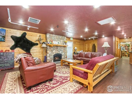 Fireplace, Interior, Living room, Recessed Lighting, Stone Walls, Wood Texture Flooring, Wooden Walls